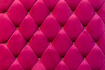 background of shocking pink velvet sofa with crystal button
