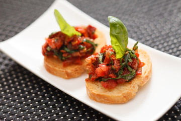 Canvas Print - bruschettas with chopped tomato and basil