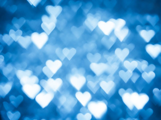 Blue heart bokeh Christmas light holiday background.