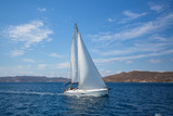 Fototapeta  - Luxury yacht at regatta. Sailing in the wind through the waves at the Aegean Sea.