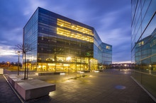 Office Building With Glass Facade,Modern Office Building In The Evening