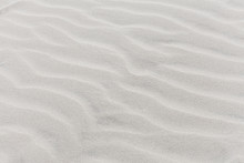 Waves On Beach Of Gray Sand