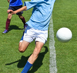 Young soccer players in action