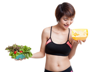 Wall Mural - Beautiful Asian healthy girl salad and potato chips.