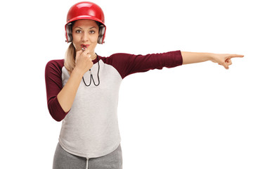 Canvas Print - Female baseball coach blowing a whistle and pointing right