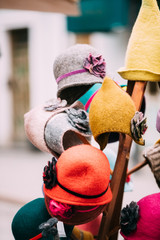 Wall Mural - Colorful Traditional European Caps Hats At Winter Christmas Mark