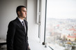 © F8  \ Suport Ukraine - Young business man look in window at his office