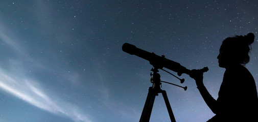 Wall Mural - woman with telescope watching the stars. stargazing woman and ni