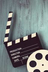 Clapperboards and the reel of film