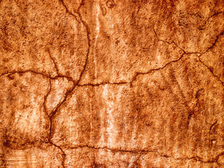 old wall with orange brown stained plaster - grunge paint abstra