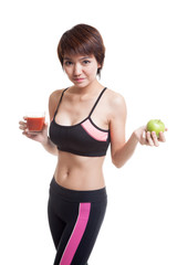 Wall Mural - Beautiful healthy Asian girl with tomato juice and apple.