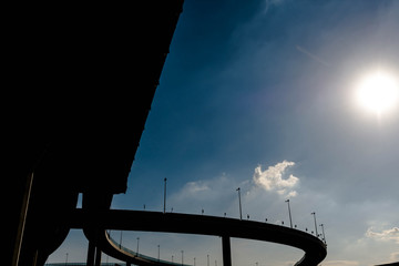 Wall Mural - Silhouette of highway ramps on a sunny day