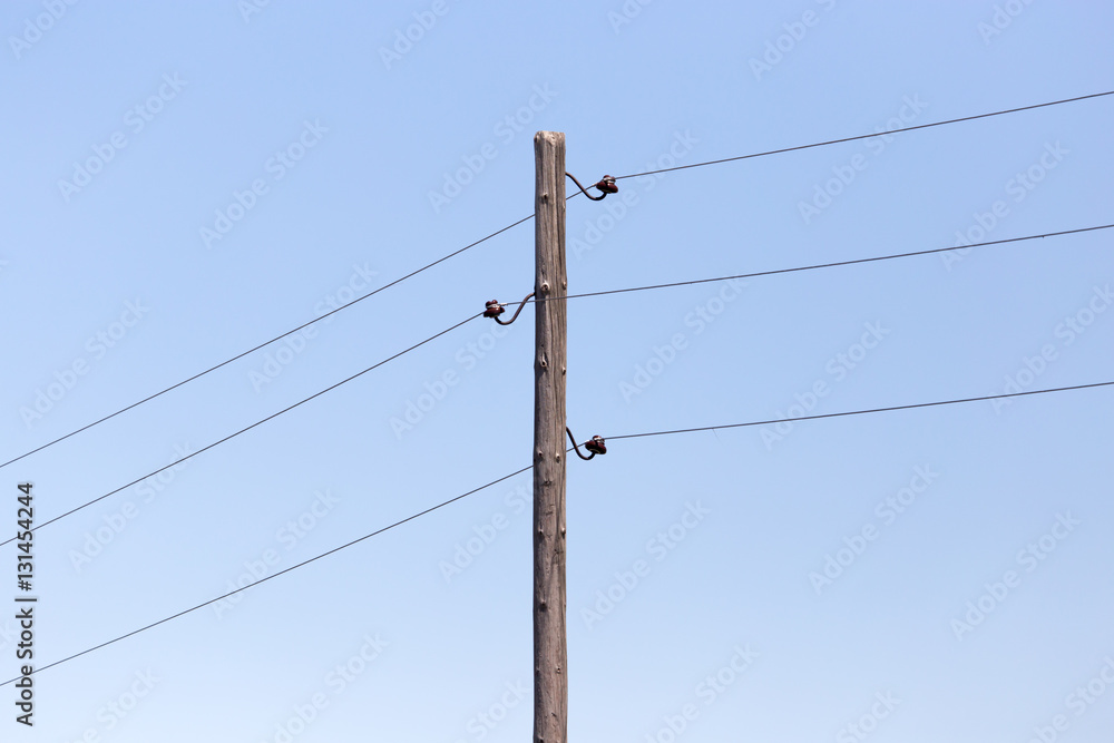 electric pole on the background of blue sky
