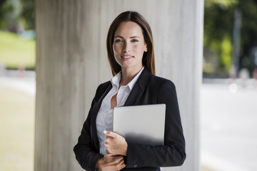 Business woman holding a tablet pc