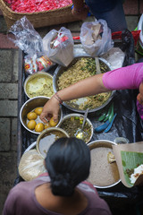 Street Food at the Ubud, Bali Traditional Public Market. Delicious street food, eggs, noodles, rice, and soup can be purchased at the traditional public market in the village of Ubud, Bali, Indonesia.