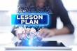 © WrightStudio - Woman is using tablet pc, pressing on virtual screen and selecting lesson plan.