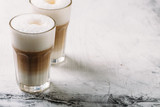 Original latte macchiato coffee on white and grey background