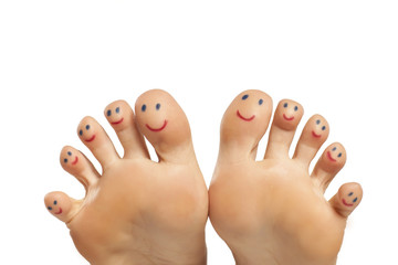 female foot and smiles drawn on the toes