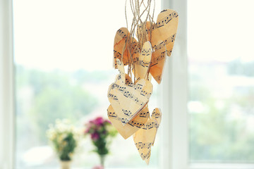 Wall Mural - Paper hearts with music notes hanging on thread