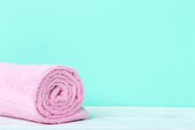 Pink Towel On A Green Background