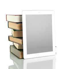 Tablet and books isolated on white