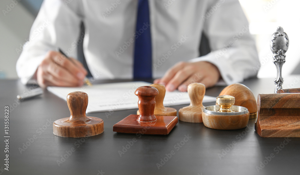 Stamps and ink pad on notary public table