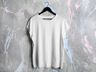 Wall Mural - Blank white t-shirt on grunge background