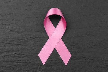 Poster - Pink ribbon on dark textured background. Breast cancer concept