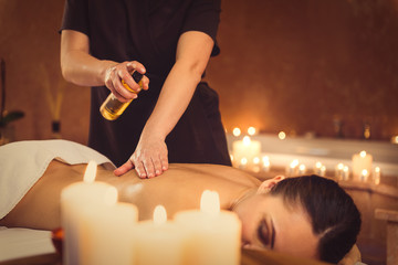 Wall Mural - Beautician massaging female back at wellness center