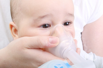 Baby boy at the hospital gets inhaler treatment for cough