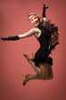 Pretty actress in black retro dress dancing charleston