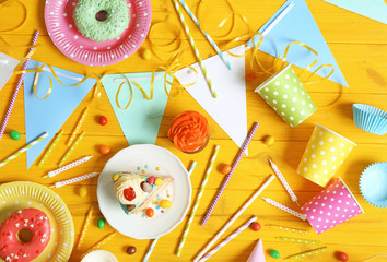 Wall Mural - Bright birthday background with sweets and decorations