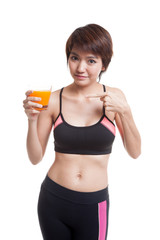 Wall Mural - Beautiful Asian healthy girl point to orange juice.