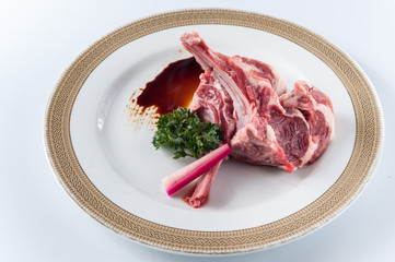 Canvas Print - raw fresh lamb chop on white background