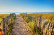 © Jo Ann Snover - Boardwalk through the dunes on the Maine coast with colorful ropes tied on the fence