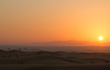 Hot Sunrise In The Desert Dunes Of Dubai, United Arab Emirates.