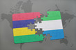 puzzle with the national flag of mauritius and sierra leone on a world map