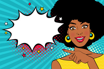 Wow female face. Young sexy surprised african american woman with open smile and hand pointing on empty speech bubble. Vector colorful background in pop art retro comic style. Party invitation poster.