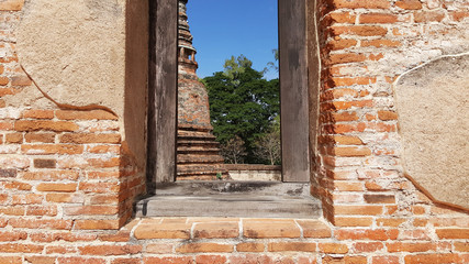 ancient brick window with nature and old brick temple outside view in historical temple