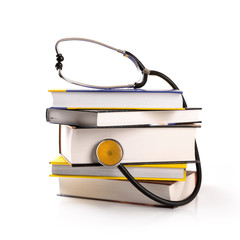 medical education - stack of books with stethoscope on white