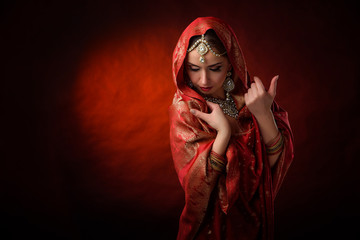 Portrait of beautiful indian girl . Young hindu woman model kundan jewelry . Traditional costume