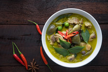 Thai Food Chicken Green Curry On Dark Wooden Background. Top View