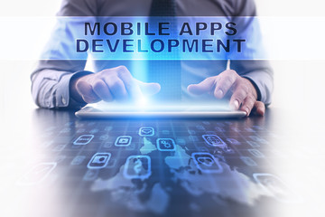 mobile apps development concept. businessman working with modern tablet pc.