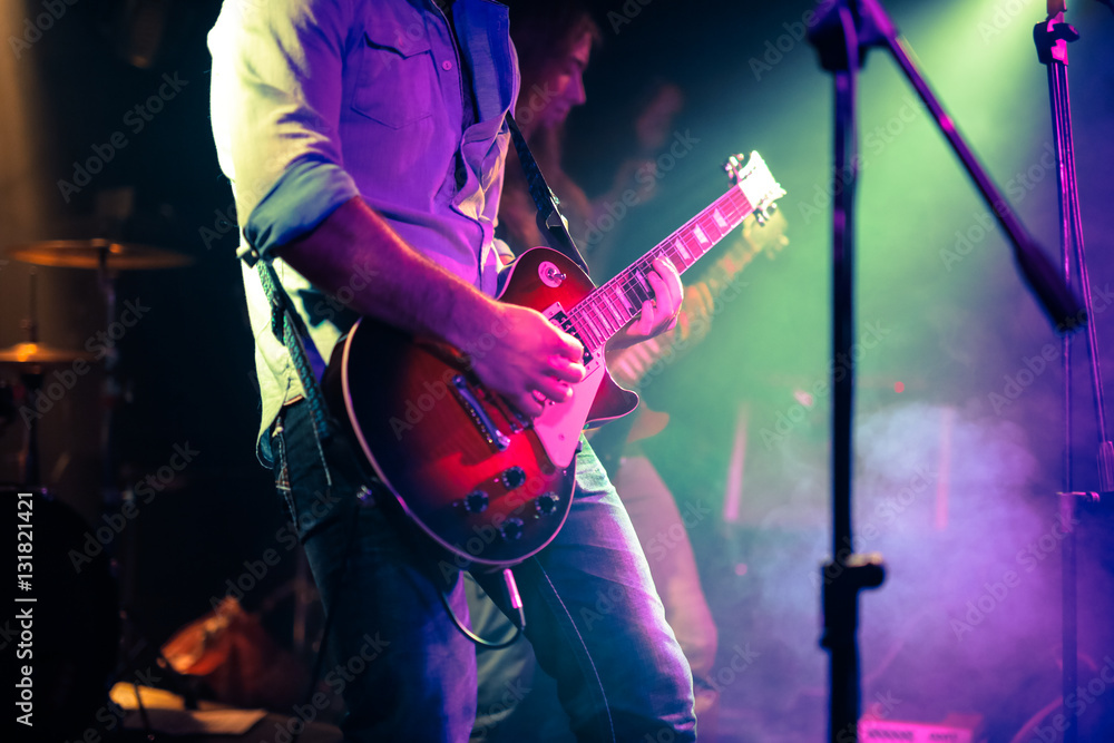 guitarist playing electrical guitar on a rock concert - obrazy, fototapety, plakaty 