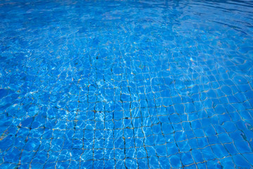 blue and bright waer with sun reflection