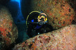 Scuba diver exploring underwater cave