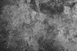 © Suradech - Dark grunge textured cement wall closeup