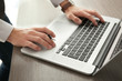© Africa Studio - Businessman using laptop, close up