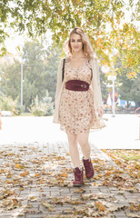 beautiful woman walking in autumn Park