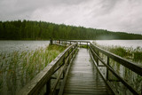 Fototapeta Pomosty - A beautiful lake landscape with footbridge in Finland